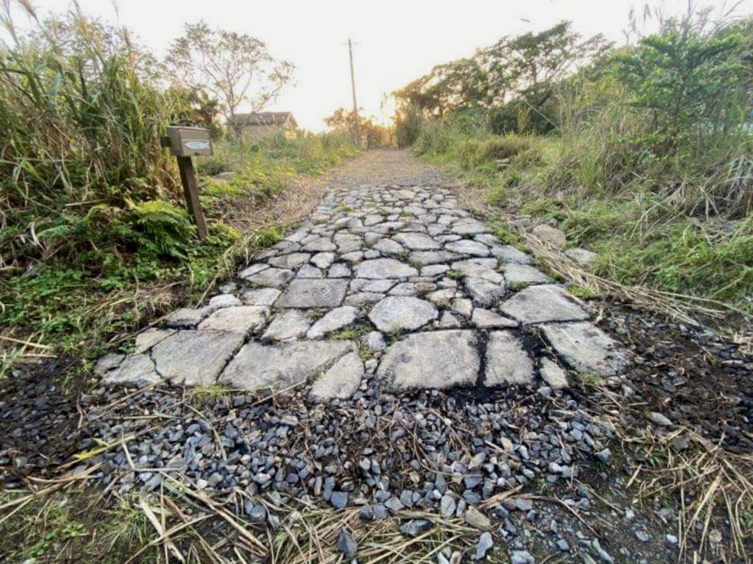 A permeable stone path that lets stormwater soak in and reduces yard flooding